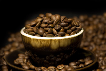 Roasted coffee beans in coffee cup