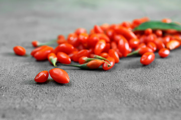 Fresh goji berries on table, closeup