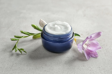 Jar of body cream on table