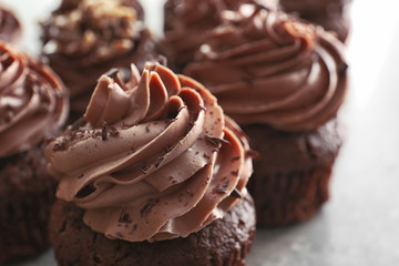 Tasty chocolate cupcakes on table, closeup