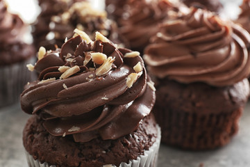 Tasty chocolate cupcakes on table, closeup