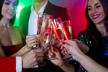 Celebration and party. People and holidays concept. Happy and smiling friends clinking glasses of champagne at party. New year. Birthday