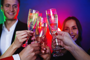 Celebration and party. People and holidays concept. Happy and smiling friends clinking glasses of champagne at party. New year. Birthday