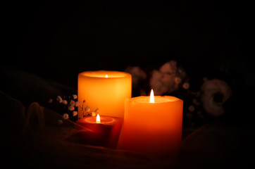 Burning candles on dark background