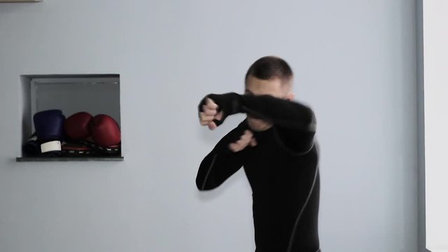 guy boxer trains in the gym