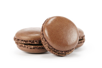 three chocolate macarons isolated on white