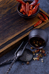 Empty wooden board for meat and dry red pepper