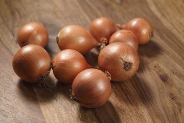 brown onions on old wood table