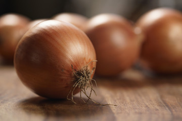 brown onions on old wood table
