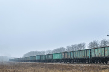 Freight train, railway wagons with motion blur effect. Transportation, railroad