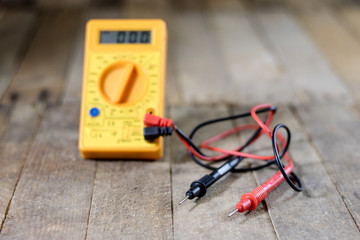 Electronic workshop. Electric meter and soldering iron.