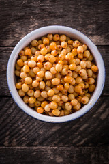 Seabuckthorn berries branch on vintage background. healthy food