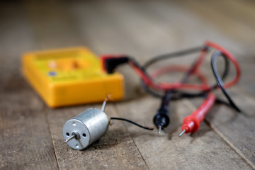Electronic workshop. Electric meter and soldering iron.