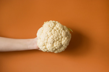 Woman holding a beautiful fresh raw cauliflower