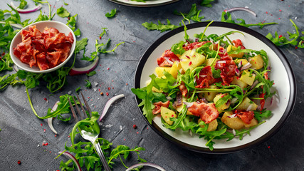 Fresh crispy Bacon, Potato salad with green vegetable on plate