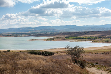 wide bay against backdrop of mountain ridge