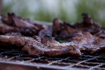 Grilled pork on charcoal griddle