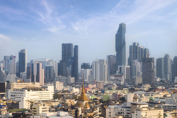 Fototapeta na wymiar skyline of Bangkok city with blue sky background, Bangkok city is modern metropolis of Thailand and favorite of tourists.
