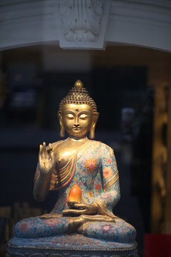 Gold Buddha Statue in a Window