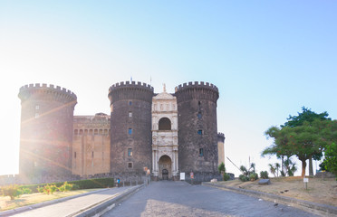 Fototapeta na wymiar Medieval Castle Nuovo with sunshine, Naples Italy