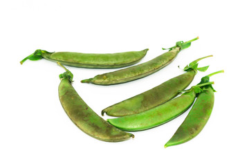 Old green with brown of sugar Peas on white background