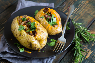 Baked potatoes with bacon and fresh herbs