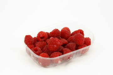 Raspberries in a plastic box