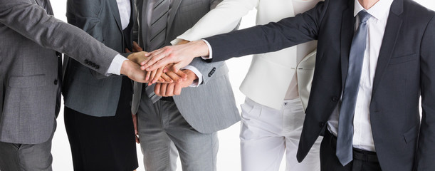 Business people stacking hands