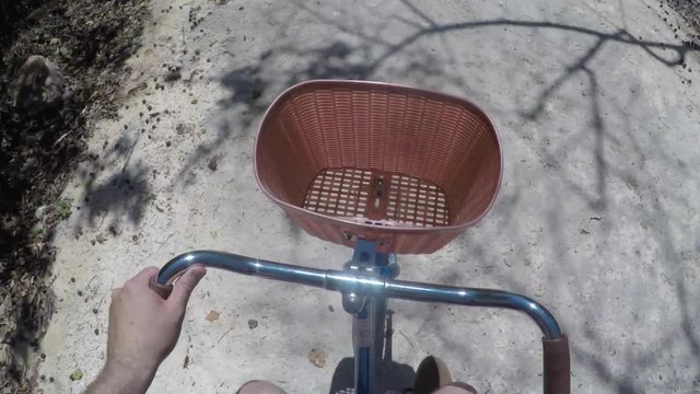 A man riding his bike on a dirt path in mexican jungle