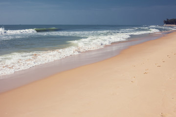Fototapeta na wymiar Beautiful sand beach and tropical turquoise blue sea view