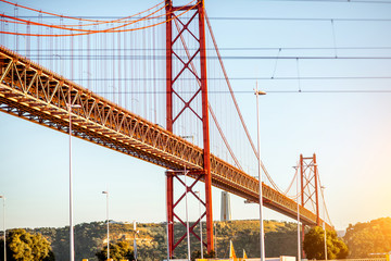 Landscape view on the 25th of April Bridge during the sunset in Lisbon city, Portugal