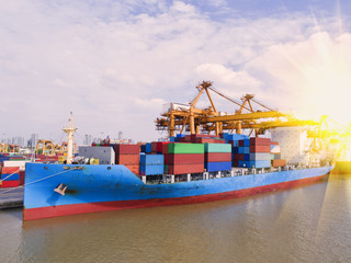 Fototapeta premium container,container ship in import export and business logistic,By crane,Trade Port , Shipping,cargo to harbor.Aerial view,Water transport,International,Shell Marine,transportation,logistic,trade,port