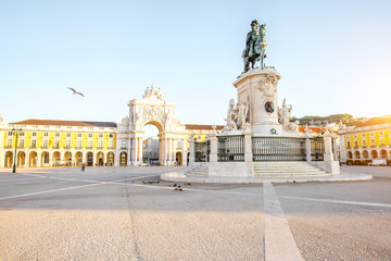 Fototapeta na wymiar Morning view on the Commerce square with statue fo king Joseph and Triumphal arch in Lisbon city, Portugal
