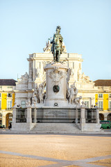Morning view on the Commerce square with statue fo king Joseph and Triumphal arch in Lisbon city,...
