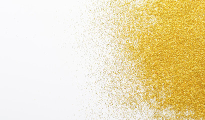 Golden glitter sand texture, abstract background.