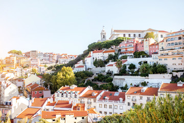 Obraz premium Cityscape view on the old town with Graca church near the castle hill in Lisbon city, Portugal