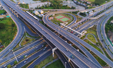 Aerial view Road roundabout, Expressway with car lots in the city in Thailand.beautiful Street , downtown,cityscape,Top view. Background,Aerial view city scape