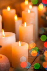 Obraz na płótnie Canvas Christmas candles and lights on the eve of the New Year or Christmas, Christmas card