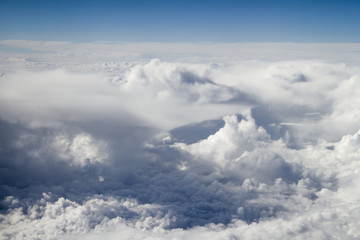 Above the clouds. White clouds.