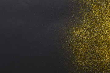 Golden glitter sand texture, abstract background.