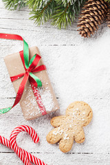Christmas gift, gingerbread man, candy canes and fir tree