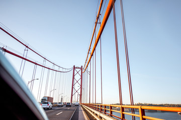 Driving on the famous 25th of April bridge in Lisbon city, Portugal