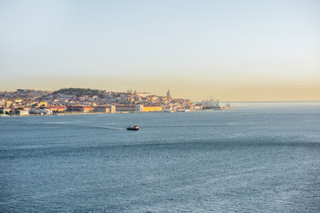 Fototapeta premium View from the river on the Lisbon old town during the morning light in Portugal