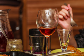 Detailed closeup of glass with wine during dinner