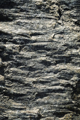 dark horizontal folded stone