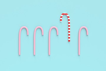 christmas lolipop candy canes on mint pastel background.christmas sweet concept