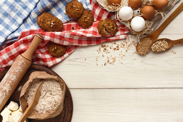 Oatmeal cookies and baking ingredients for homemade pastry background