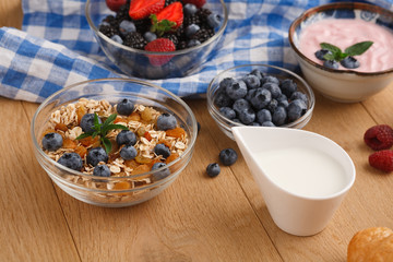 Rich breakfast on natural wooden table