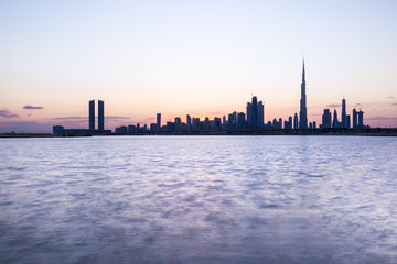Fototapeta na wymiar Silhouette of Dubai Downtown at sunset.