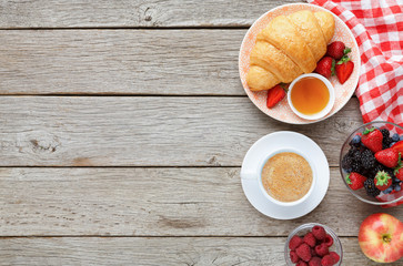 Tasty pastry, fruits and berries on rustic wood, top view